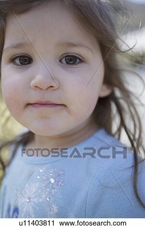 Stock Image - Portrait of girl outdoors. Fotosearch