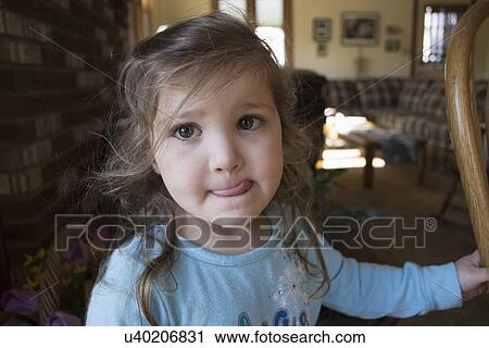 Portrait of girl sticking out tongue View Large Photo Image Stock Image - Portrait of girl sticking out tongue. Fotosearch