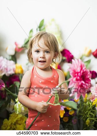 Portrait of little girl (2-3) with flower View Large Photo Image Stock Image - Portrait of little girl (2-3) with flower. Fotosearch