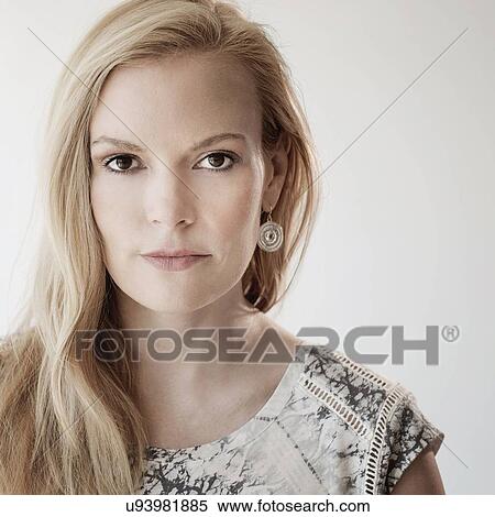 Portrait of mid-adult woman on white background View Large Photo Image Stock Photography - Portrait of mid-adult woman on white background. Fotosearch