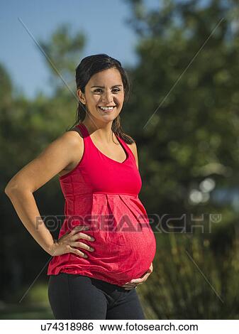 Portrait of pregnant woman smiling View Large Photo Image Stock Photograph - Portrait of pregnant woman smiling. Fotosearch