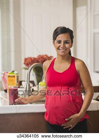 Portrait of pregnant woman smiling View Large Photo Image Stock Photography - Portrait of pregnant woman smiling. Fotosearch