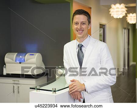 Portrait of smiling dentist View Large Photo Image Picture - Portrait of smiling dentist . Fotosearch