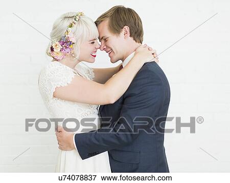 Portrait of smiling newlywed couple View Large Photo Image Stock Photo - Portrait of smiling newlywed couple. Fotosearch