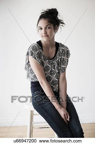 Portrait of teenage girl (14-15) in studio View Large Photo Image Stock Image - Portrait of teenage girl (14-15) in studio. Fotosearch