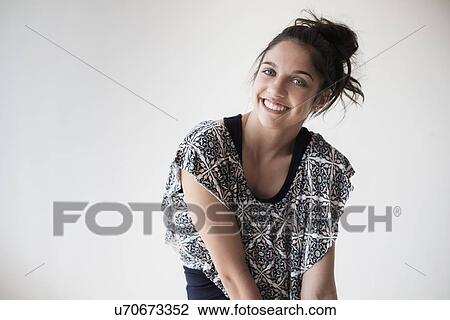 Portrait of teenage girl (14-15) smiling in studio View Large Photo Image Stock Image - Portrait of teenage girl (14-15) smiling in studio. Fotosearch