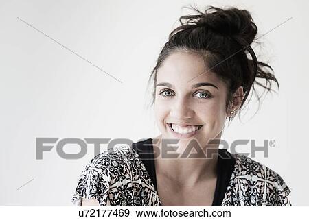 Portrait of teenage girl (14-15) smiling in studio View Large Photo Image Stock Photo - Portrait of teenage girl (14-15) smiling in studio. Fotosearch