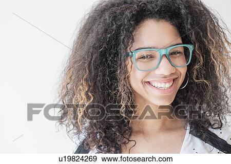 Portrait of teenage girl (16-17) wearing eyeglasses View Large Photo Image Stock Photo - Portrait of teenage girl (16-17) wearing eyeglasses. Fotosearch