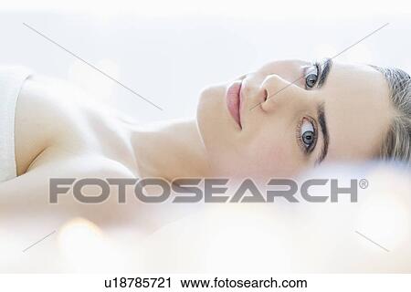 Portrait of young woman during beauty treatment View Large Photo Image Stock Image - Portrait of young woman during beauty treatment. Fotosearch