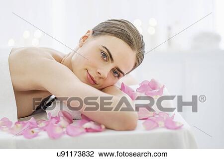 Stock Image - Portrait of young woman during beauty treatment. Fotosearch