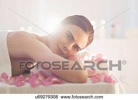 Portrait of young woman during beauty treatment View Large Photo Image Stock Photo - Portrait of young woman during beauty treatment. Fotosearch