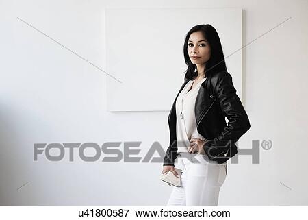 Portrait of young woman in studio View Large Photo Image Stock Photo - Portrait of young woman in studio. Fotosearch