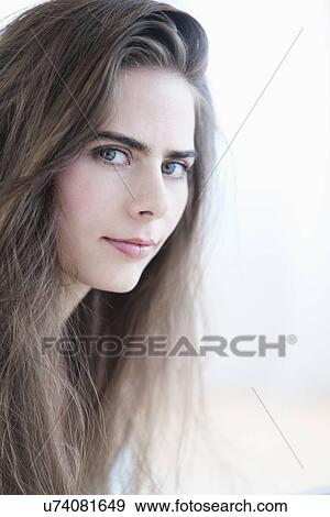 Portrait of young woman with blue eyes View Large Photo Image Stock Photo - Portrait of young woman with blue eyes. Fotosearch