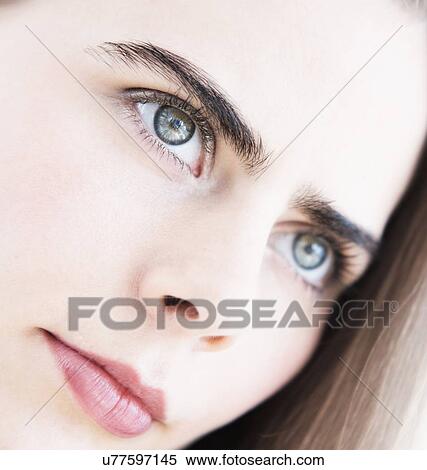Portrait of young woman with blue eyes View Large Photo Image Stock Photography - Portrait of young woman with blue eyes. Fotosearch