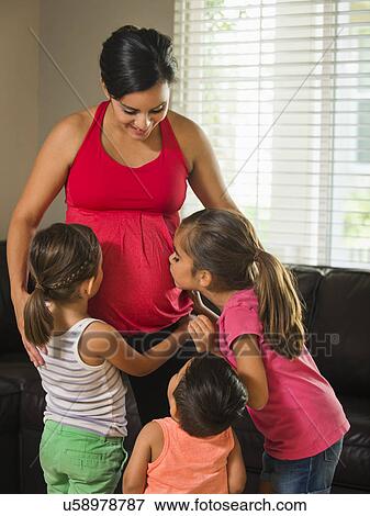 Pregnant mother and children (2-3, 6-7, 8-9) View Large Photo Image Stock Photo - Pregnant mother and children (2-3, 6-7, 8-9) . Fotosearch