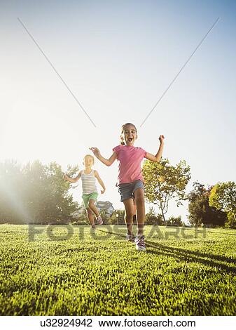 Siblings (2-3, 6-7, 8-9) playing in park View Large Photo Image Stock Image - Siblings (2-3, 6-7, 8-9) playing in park. Fotosearch