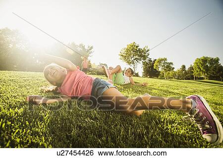 Siblings (2-3, 6-7, 8-9) playing in park View Large Photo Image Stock Photograph - Siblings (2-3, 6-7, 8-9) playing in park. Fotosearch