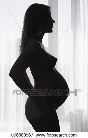 Silhouette of pregnant woman View Large Photo Image Stock Photo - Silhouette of pregnant woman. Fotosearch