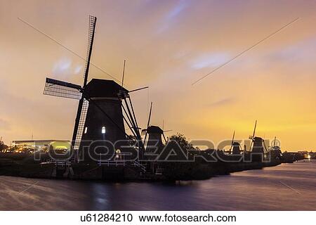 Silhouette of traditional windmills View Large Photo Image Stock Image - Silhouette of traditional windmills. Fotosearch