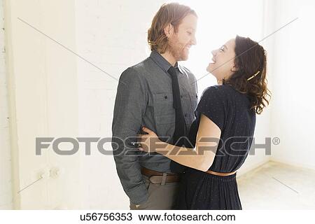 Stock Image - Smiling couple embracing. Fotosearch