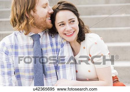 Stock Photography - Smiling couple embracing. Fotosearch