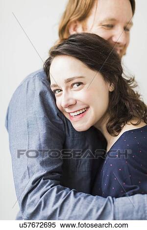 Smiling couple embracing View Large Photo Image Stock Photography - Smiling couple embracing. Fotosearch