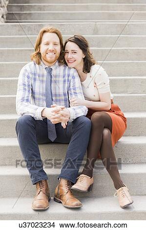 Smiling couple sitting on steps View Large Photo Image Picture - Smiling couple sitting on steps. Fotosearch