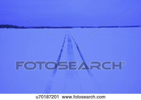 Snowmobile tracks on frozen lake View Large Photo Image Stock Image - Snowmobile tracks on frozen lake. Fotosearch
