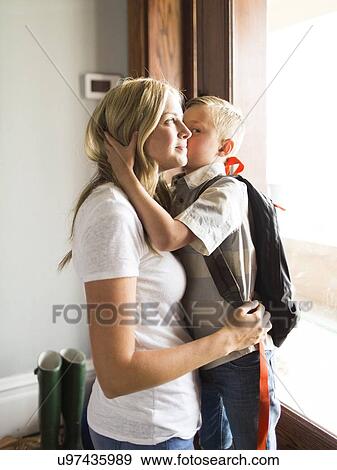 Son (6-7) kissing mother on cheek View Large Photo Image Stock Photo - Son (6-7) kissing mother on cheek. Fotosearch