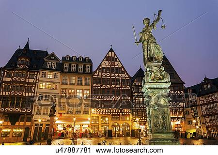Statue on illuminated square View Large Photo Image Stock Image - Statue on illuminated square. Fotosearch