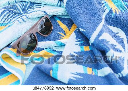 Sunglasses on towel View Large Photo Image Stock Image - Sunglasses on towel. Fotosearch
