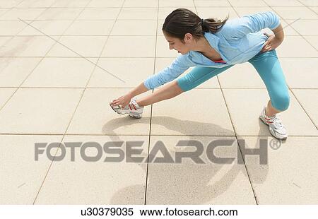 Teenage girl (14-15) stretching View Large Photo Image Stock Photography - Teenage girl (14-15) stretching. Fotosearch
