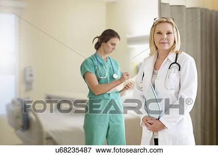 Two female doctors in hospital View Large Photo Image Stock Photo - Two female doctors in hospital. Fotosearch
