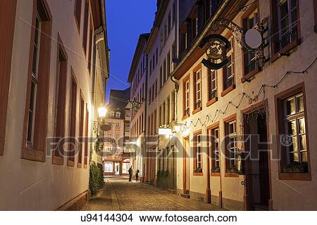 View along illuminated old town street View Large Photo Image Picture - View along illuminated old town street. Fotosearch