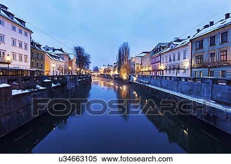 Stock Photography - View along Ljubljanica River at dusk. Fotosearch