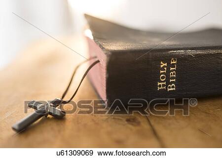 Stock Photo - View of Bible and cross. Fotosearch