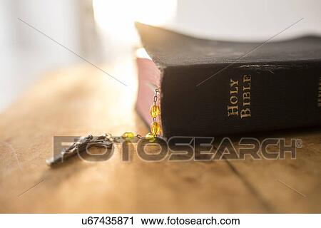 View of Bible and rosary beads View Large Photo Image Stock Image - View of Bible and rosary beads. Fotosearch
