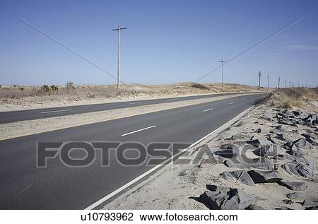 Stock Image - View of empty highway in desert. Fotosearch