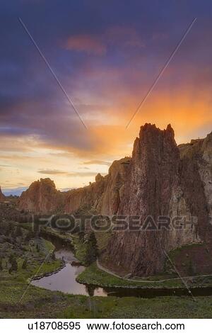 View of rock formation at sunset View Large Photo Image Stock Photography - View of rock formation at sunset. Fotosearch
