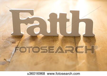 Stock Photo - View of single word 'faith'. Fotosearch