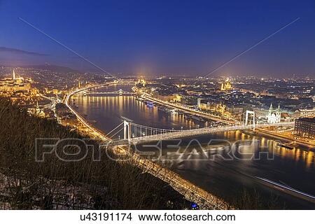 Waterfront cityscape with illuminated Elisabeth Bridge View Large Photo Image Picture - Waterfront cityscape with illuminated Elisabeth Bridge. Fotosearch
