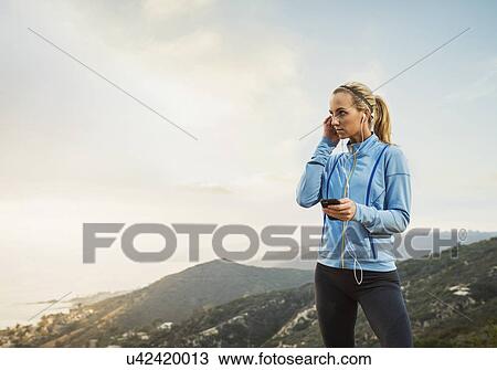 Woman checking smart phone View Large Photo Image Stock Image - Woman checking smart phone. Fotosearch