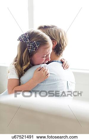Stock Image - Woman consoling her child (4-5). Fotosearch
