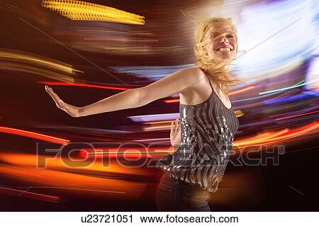 Woman dancing in club View Large Photo Image Stock Image - Woman dancing in club. Fotosearch