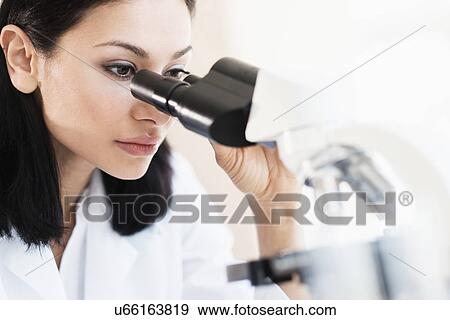 Stock Photo - Woman doing laboratory research. Fotosearch