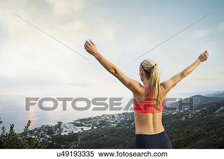Woman exercising in mountains View Large Photo Image Stock Photography - Woman exercising in mountains. Fotosearch