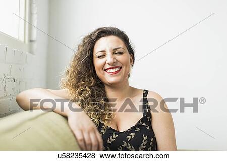 Woman laughing with closed eyes View Large Photo Image Stock Photo - Woman laughing with closed eyes. Fotosearch