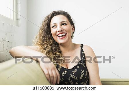 Woman looking away and laughing View Large Photo Image Stock Photography - Woman looking away and laughing. Fotosearch