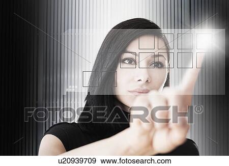Stock Photo - Woman touching screen button. Fotosearch