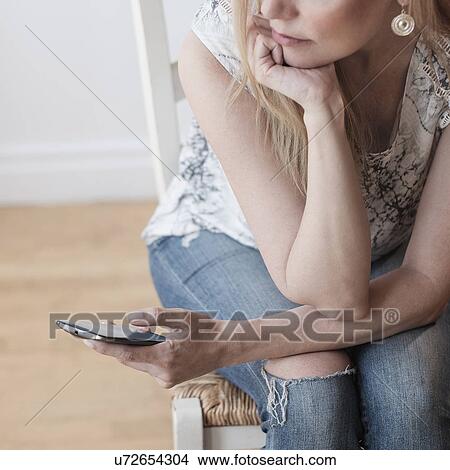 Woman using smart phone View Large Photo Image Picture - Woman using smart phone. Fotosearch
